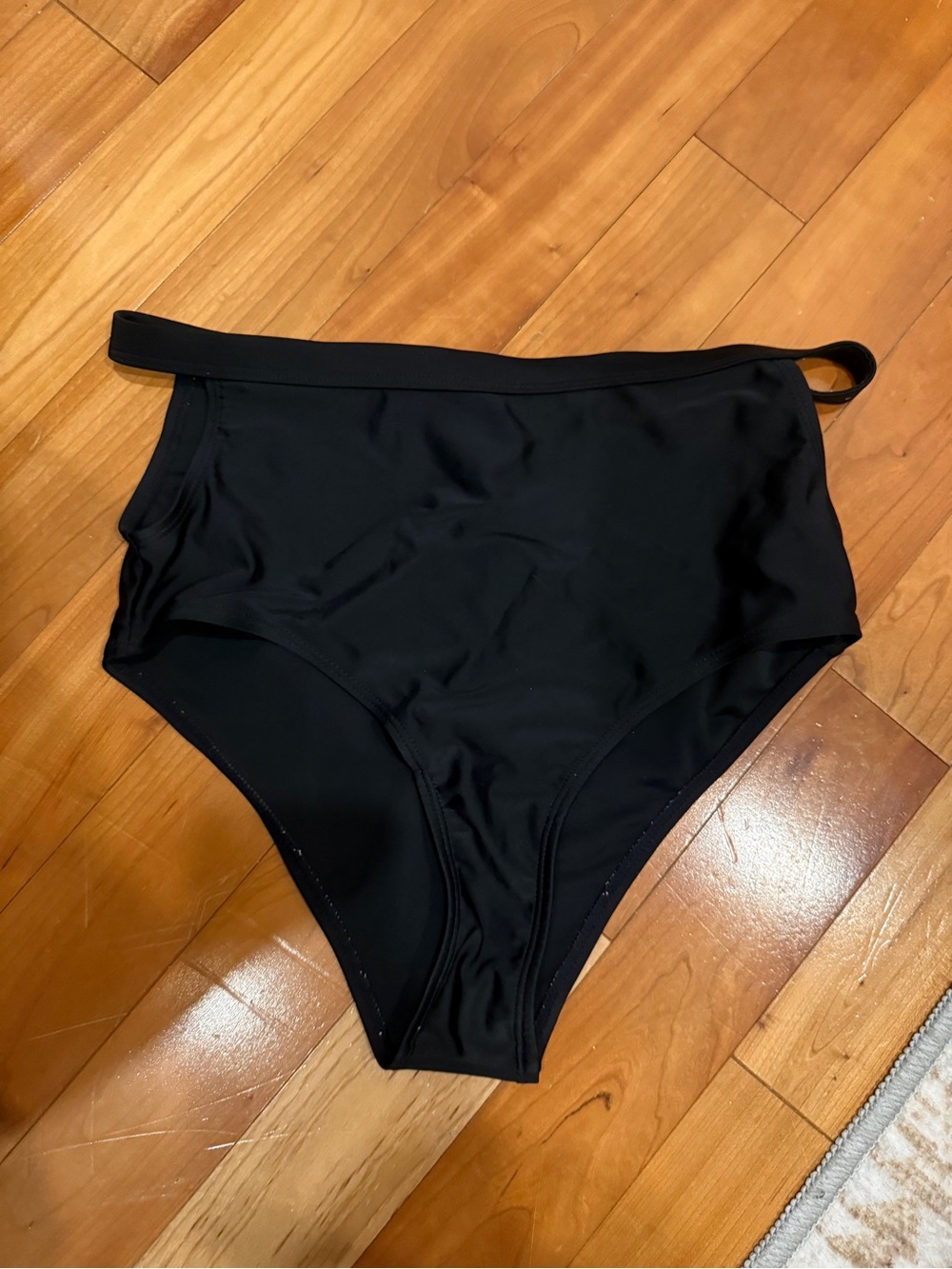 High-Waist Black Swim Bottom with Stylish Strap Detail